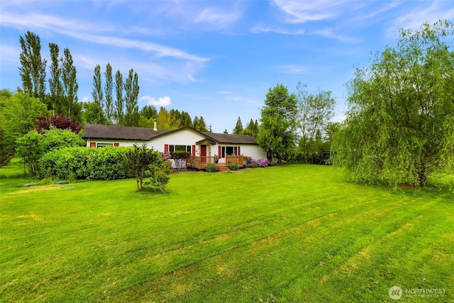 2957 Unick Rd, Ferndale, WA 98248 - view of grassy yard with a wooden deck