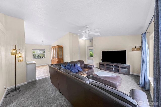 2957 Unick Rd, Ferndale, WA 98248 - living area with baseboards, carpet floors, vaulted ceiling, ceiling fan, and a textured ceiling