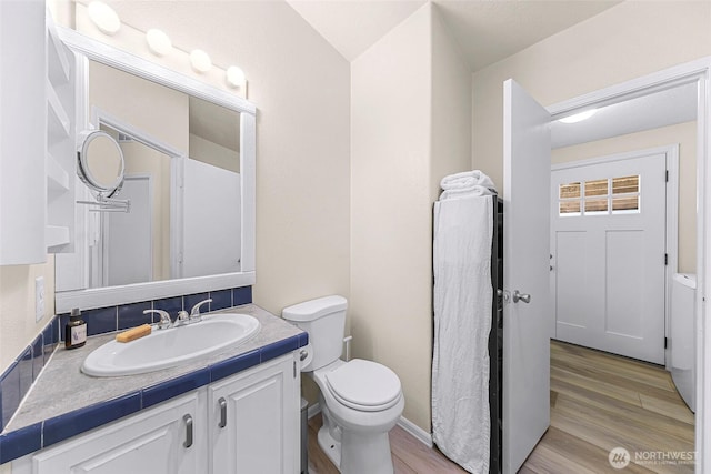 2957 Unick Rd, Ferndale, WA 98248 - bathroom with vanity, toilet, and wood finished floors