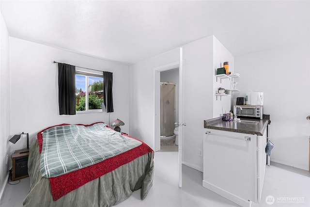 2957 Unick Rd, Ferndale, WA 98248 - bedroom with connected bathroom and baseboards