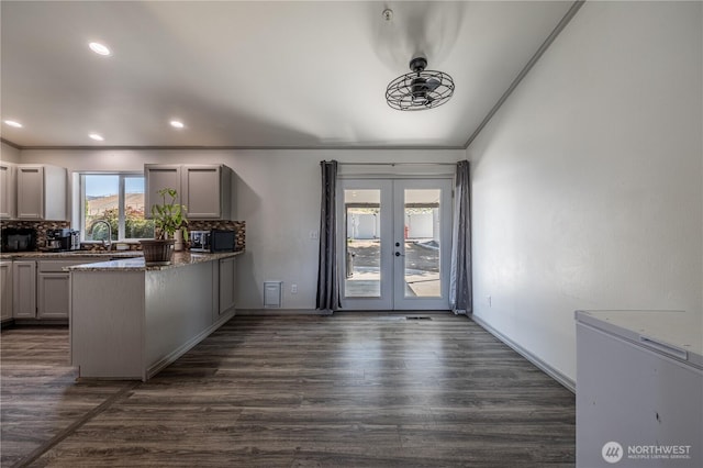 2438 Highland View Dr, East Wenatchee, WA 98802 - kitchen featuring french doors, dark wood-type flooring, backsplash, a peninsula, and recessed lighting