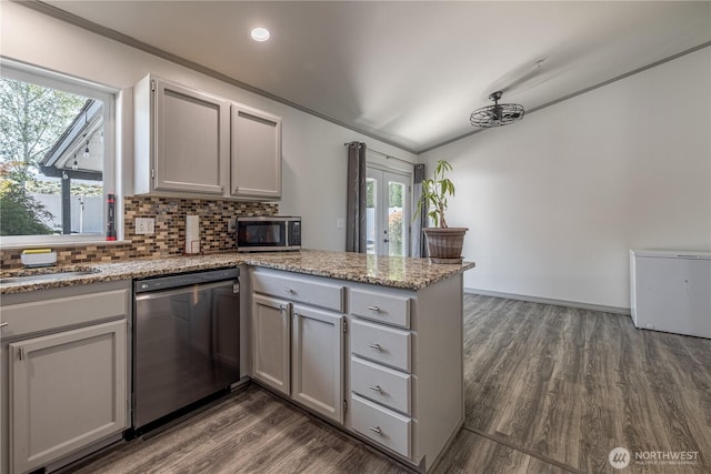 2438 Highland View Dr, East Wenatchee, WA 98802 - kitchen featuring stainless steel appliances, a peninsula, gray cabinetry, dark wood finished floors, and decorative backsplash
