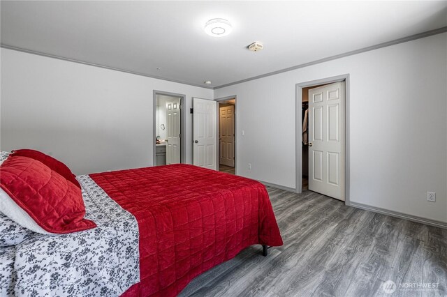 2438 Highland View Dr, East Wenatchee, WA 98802 - bedroom with wood finished floors, crown molding, and ensuite bathroom