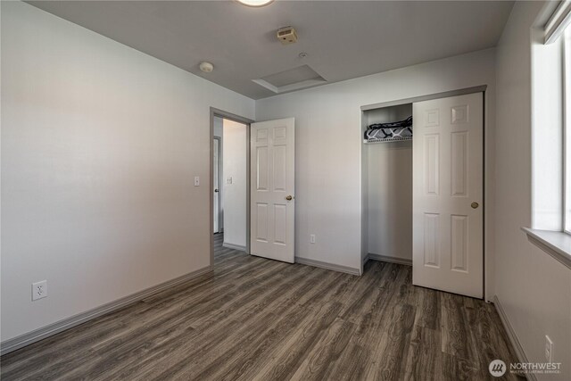 2438 Highland View Dr, East Wenatchee, WA 98802 - unfurnished bedroom featuring dark wood-type flooring, attic access, and a closet