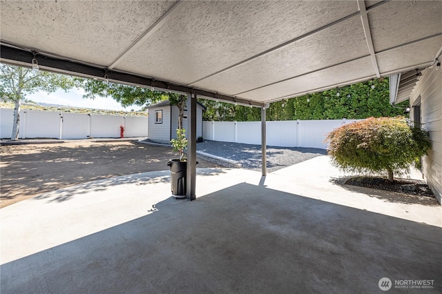 2438 Highland View Dr, East Wenatchee, WA 98802 - fenced backyard with a patio and a storage unit