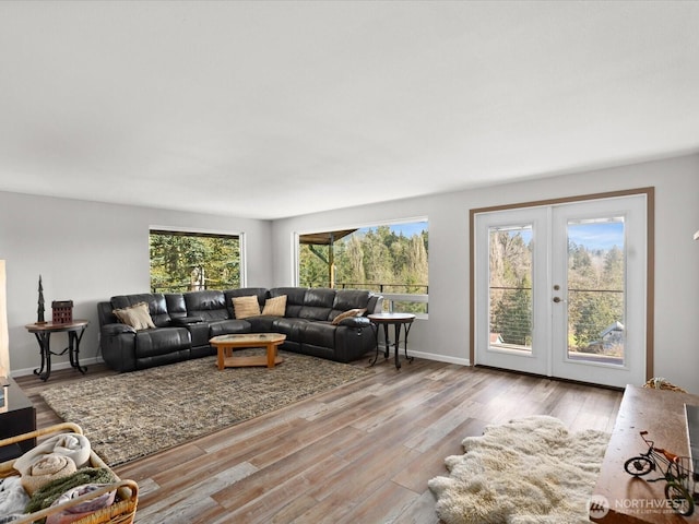 12020W Engebretsen Rd, Granite Falls, WA 98252 - living room with wood finished floors, french doors, and baseboards
