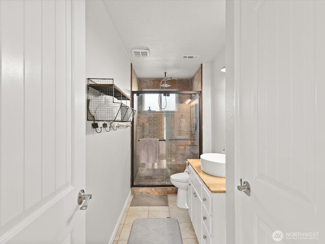 12020W Engebretsen Rd, Granite Falls, WA 98252 - full bathroom with a stall shower, toilet, tile patterned floors, vanity, and baseboards