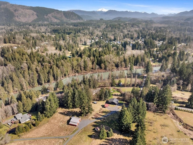 12020W Engebretsen Rd, Granite Falls, WA 98252 - aerial view of property and surrounding area featuring a forest and a mountainous background