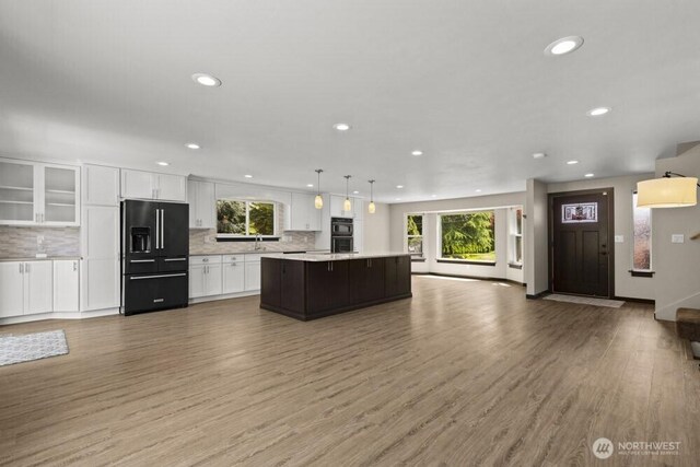5208 S 380th St, Auburn, WA 98001 - kitchen with high quality fridge, open floor plan, plenty of natural light, white cabinetry, and recessed lighting