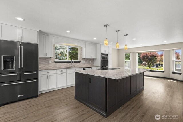 5208 S 380th St, Auburn, WA 98001 - kitchen with black appliances, white cabinets, healthy amount of natural light, and recessed lighting