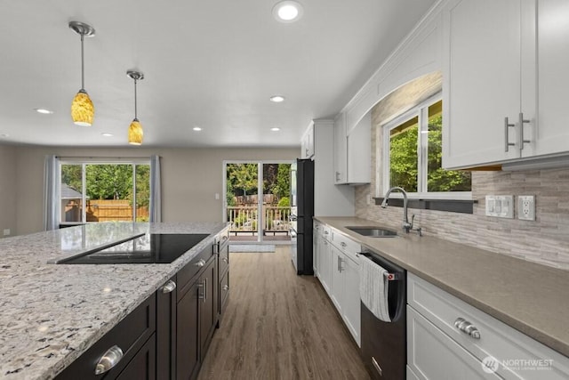 5208 S 380th St, Auburn, WA 98001 - kitchen featuring black appliances, recessed lighting, plenty of natural light, white cabinetry, and dark wood finished floors