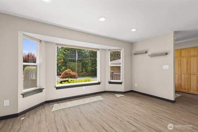 5208 S 380th St, Auburn, WA 98001 - spare room featuring wood finished floors, healthy amount of natural light, and recessed lighting