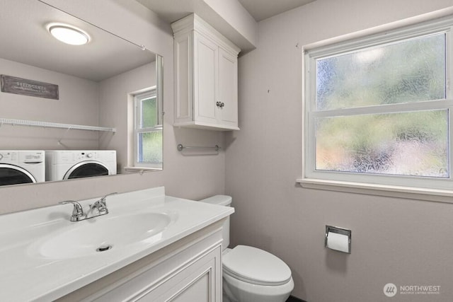 5208 S 380th St, Auburn, WA 98001 - bathroom featuring washing machine and dryer and vanity