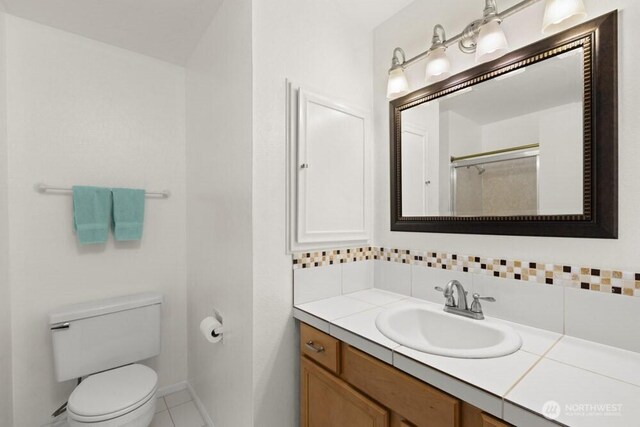 5208 S 380th St, Auburn, WA 98001 - full bath with decorative backsplash, vanity, a shower, and tile patterned floors