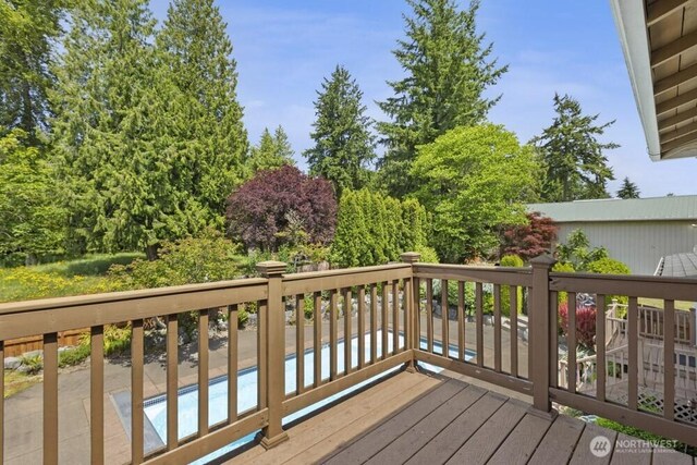5208 S 380th St, Auburn, WA 98001 - wooden deck featuring an outdoor pool