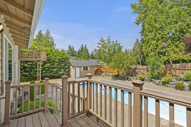 5208 S 380th St, Auburn, WA 98001 - wooden deck with a fenced backyard, a storage shed, and view of scattered trees