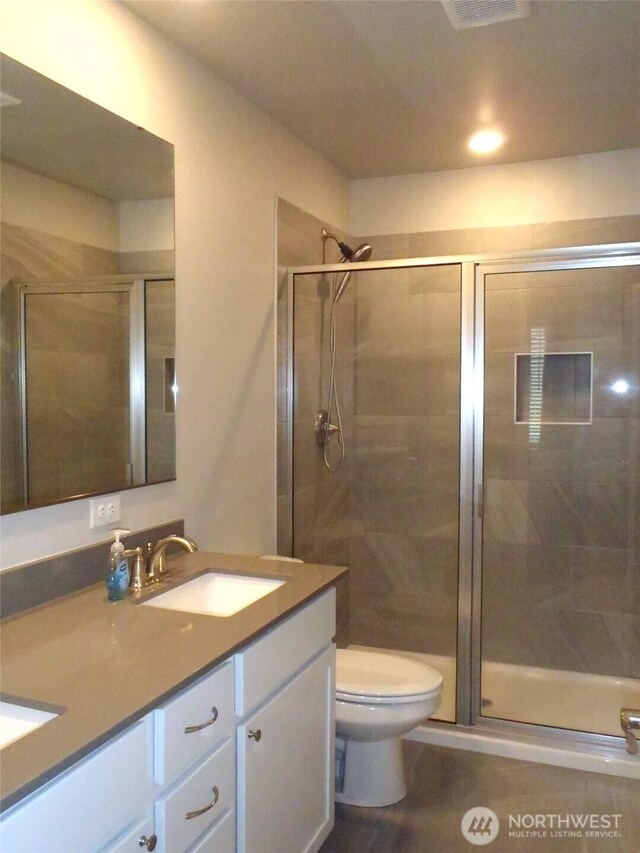 8727 E Gilman Ave, Arlington, WA 98223 - full bath featuring double vanity, toilet, and a stall shower