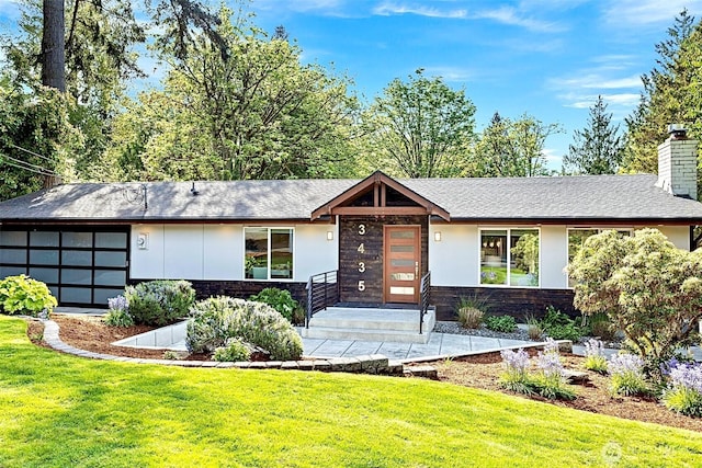 3435 103rd Pl NE, Bellevue, WA 98004 - view of front facade featuring a front lawn, a chimney, a garage, and stone siding