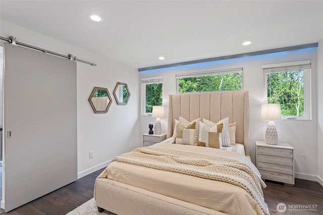 3435 103rd Pl NE, Bellevue, WA 98004 - bedroom featuring a barn door, baseboards, multiple windows, recessed lighting, and dark wood-style flooring