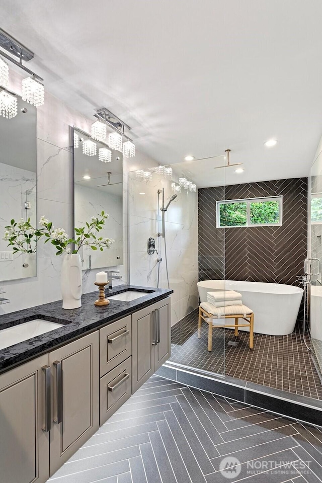 3435 103rd Pl NE, Bellevue, WA 98004 - full bathroom featuring double vanity, a marble finish shower, a freestanding tub, and tile walls