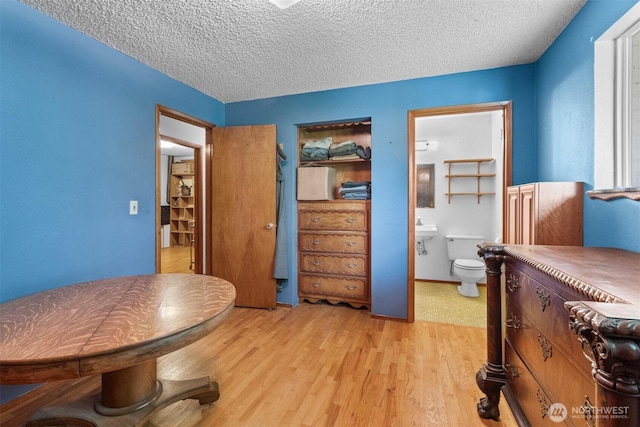 9139 Burnett Rd SE, Yelm, WA 98597 - bedroom featuring light wood-type flooring and a textured ceiling