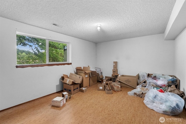 9139 Burnett Rd SE, Yelm, WA 98597 - bedroom featuring wood finished floors and a textured ceiling