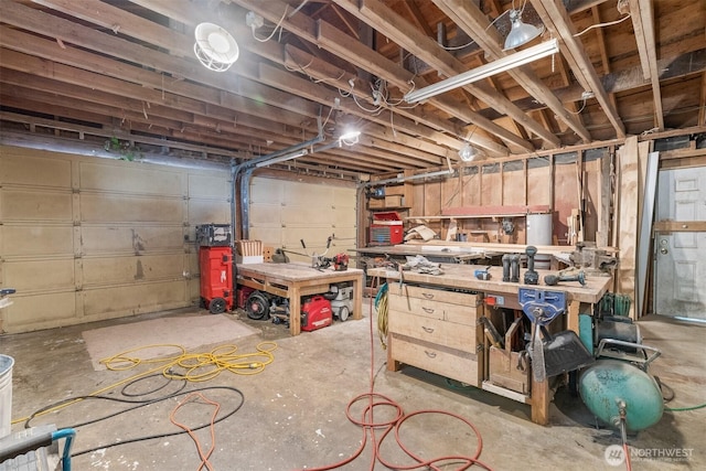 9139 Burnett Rd SE, Yelm, WA 98597 - garage featuring a workshop area
