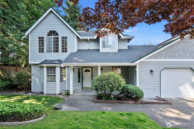 4426 82nd Avenue Ct W, University Place, WA 98466 - view of front of home featuring an attached garage, roof with shingles, covered porch, and driveway