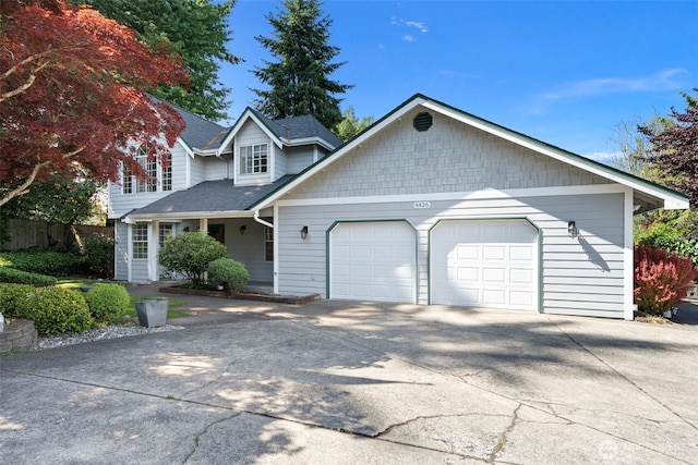 4426 82nd Avenue Ct W, University Place, WA 98466 - view of front of home with a garage, concrete driveway, and a shingled roof