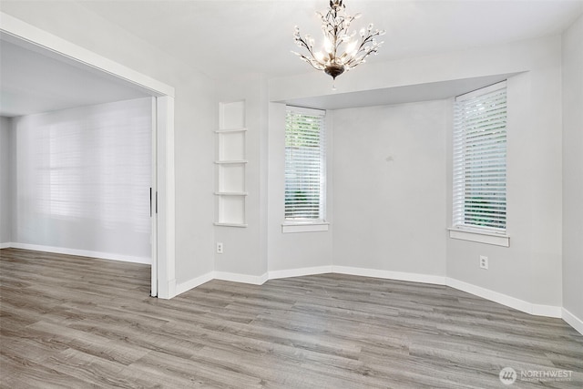 4426 82nd Avenue Ct W, University Place, WA 98466 - empty room with a chandelier, wood finished floors, and baseboards