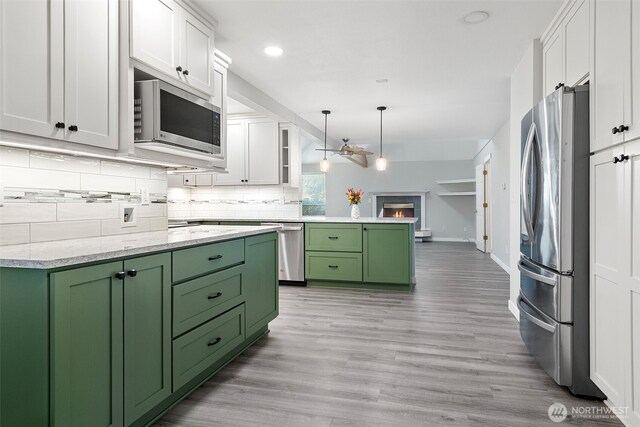 4426 82nd Avenue Ct W, University Place, WA 98466 - kitchen featuring green cabinetry, appliances with stainless steel finishes, white cabinetry, and recessed lighting