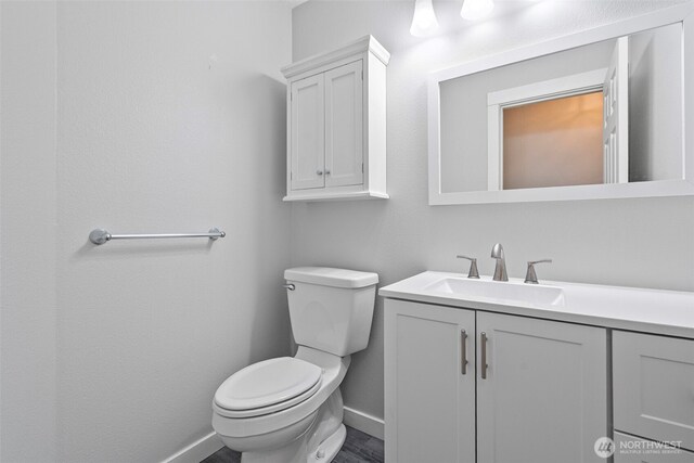 4426 82nd Avenue Ct W, University Place, WA 98466 - bathroom featuring baseboards, toilet, and vanity