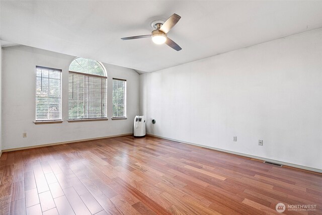 4426 82nd Avenue Ct W, University Place, WA 98466 - empty room with light wood finished floors, a ceiling fan, baseboards, and vaulted ceiling