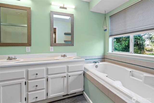 4426 82nd Avenue Ct W, University Place, WA 98466 - bathroom with double vanity, a garden tub, and a shower with shower door