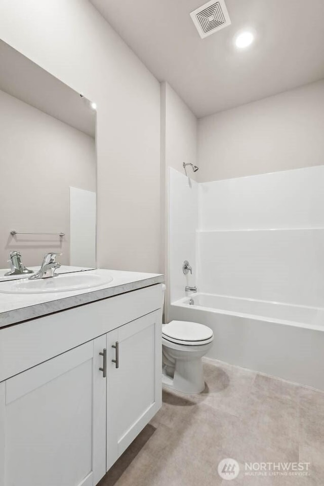 7402 281st Pl NW Unit 75, Stanwood, WA 98292 - bathroom with vanity, toilet, and tub / shower combination