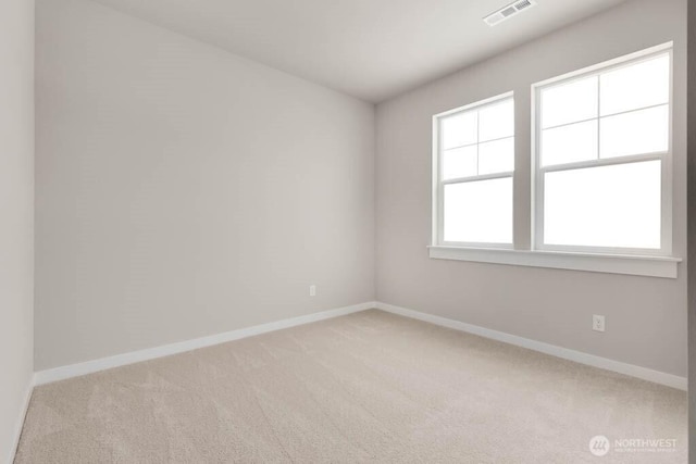 7402 281st Pl NW Unit 75, Stanwood, WA 98292 - spare room with light carpet and baseboards