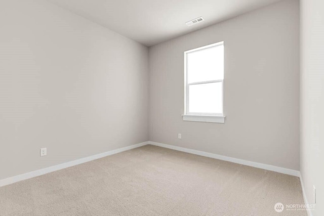 7402 281st Pl NW Unit 75, Stanwood, WA 98292 - empty room featuring light colored carpet and baseboards