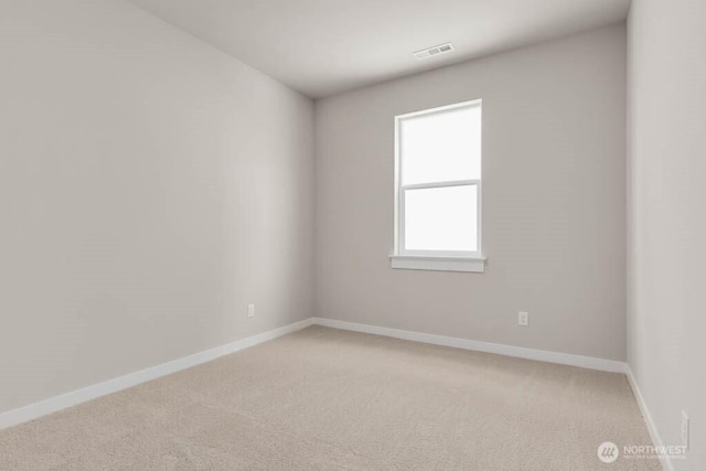 7402 281st Pl NW Unit 75, Stanwood, WA 98292 - empty room with light carpet and baseboards