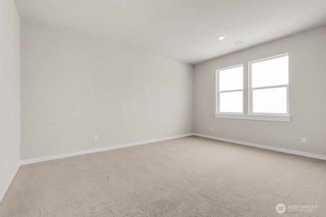 7402 281st Pl NW Unit 75, Stanwood, WA 98292 - empty room featuring light carpet, baseboards, and recessed lighting
