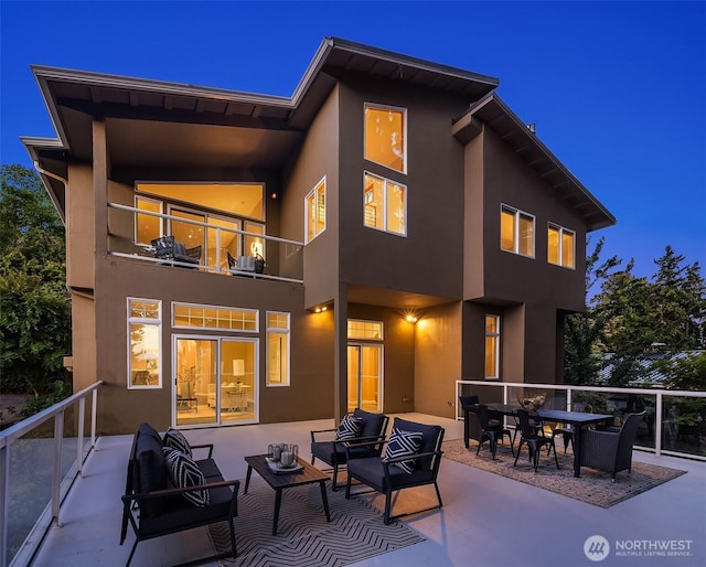 6819 SE 32nd St, Mercer Island, WA 98040 - rear view of house featuring a balcony, stucco siding, and an outdoor hangout area
