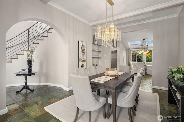 6819 SE 32nd St, Mercer Island, WA 98040 - dining area featuring stone tile floors, a chandelier, baseboards, and ornamental molding