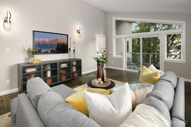 6819 SE 32nd St, Mercer Island, WA 98040 - living room with stone tile flooring, baseboards, and vaulted ceiling