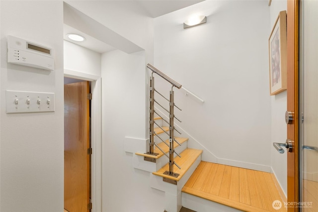 1805 N 36th St, Seattle, WA 98103 - staircase featuring wood finished floors and baseboards