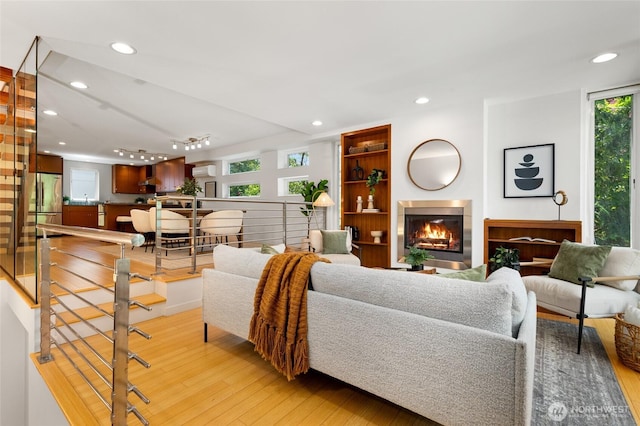 1805 N 36th St, Seattle, WA 98103 - living room featuring light wood-style floors, a fireplace, and recessed lighting