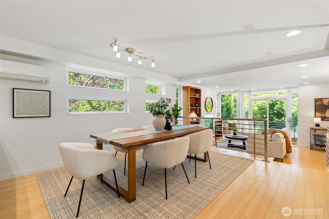 1805 N 36th St, Seattle, WA 98103 - dining room featuring a wall mounted air conditioner, light wood finished floors, recessed lighting, and track lighting