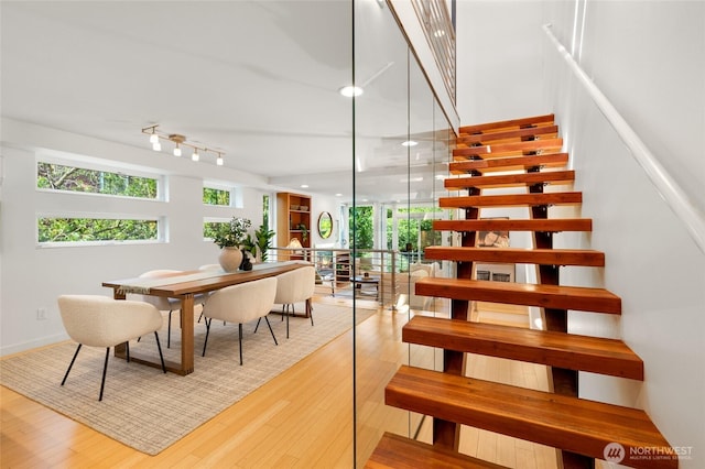 1805 N 36th St, Seattle, WA 98103 - staircase with wood finished floors, rail lighting, and recessed lighting
