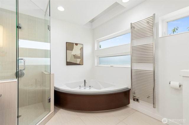 1805 N 36th St, Seattle, WA 98103 - full bathroom featuring radiator heating unit, a bath, a stall shower, and a towel warming rack