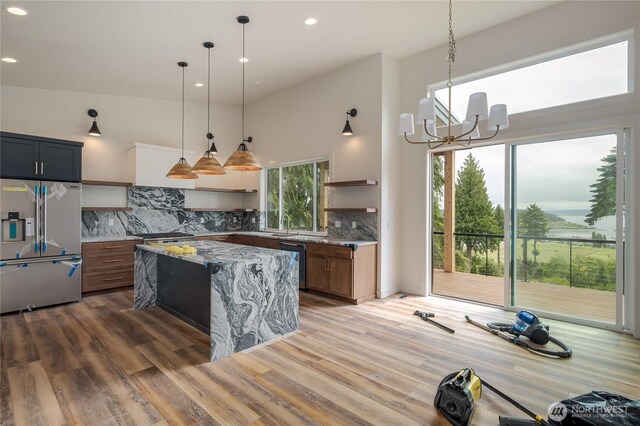 501 Vesper Way, Camano Island, WA 98282 - kitchen featuring high quality fridge, open shelves, dishwashing machine, recessed lighting, and light stone counters