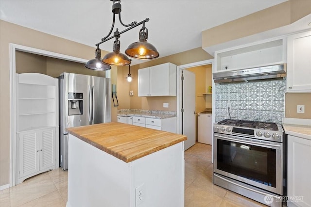 42480 N State Route 25, Davenport, WA 99122 - kitchen with stainless steel appliances, under cabinet range hood, white cabinets, and light tile patterned floors