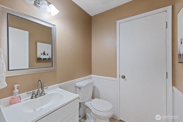 42480 N State Route 25, Davenport, WA 99122 - bathroom with a wainscoted wall, vanity, and toilet